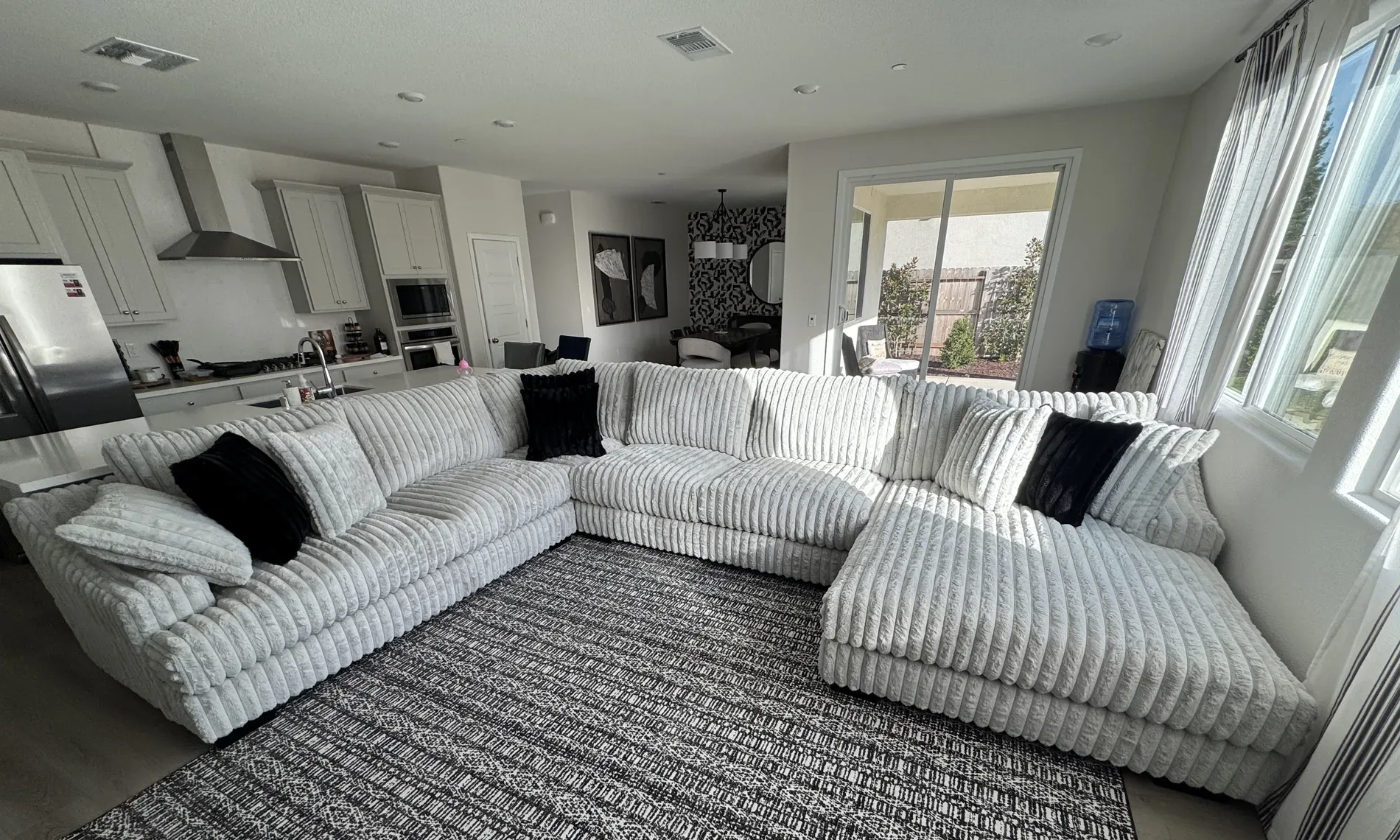 Name-brand grey sectional sofa styled in a Sacramento home — BriBri's Discount Mattress & Sofa